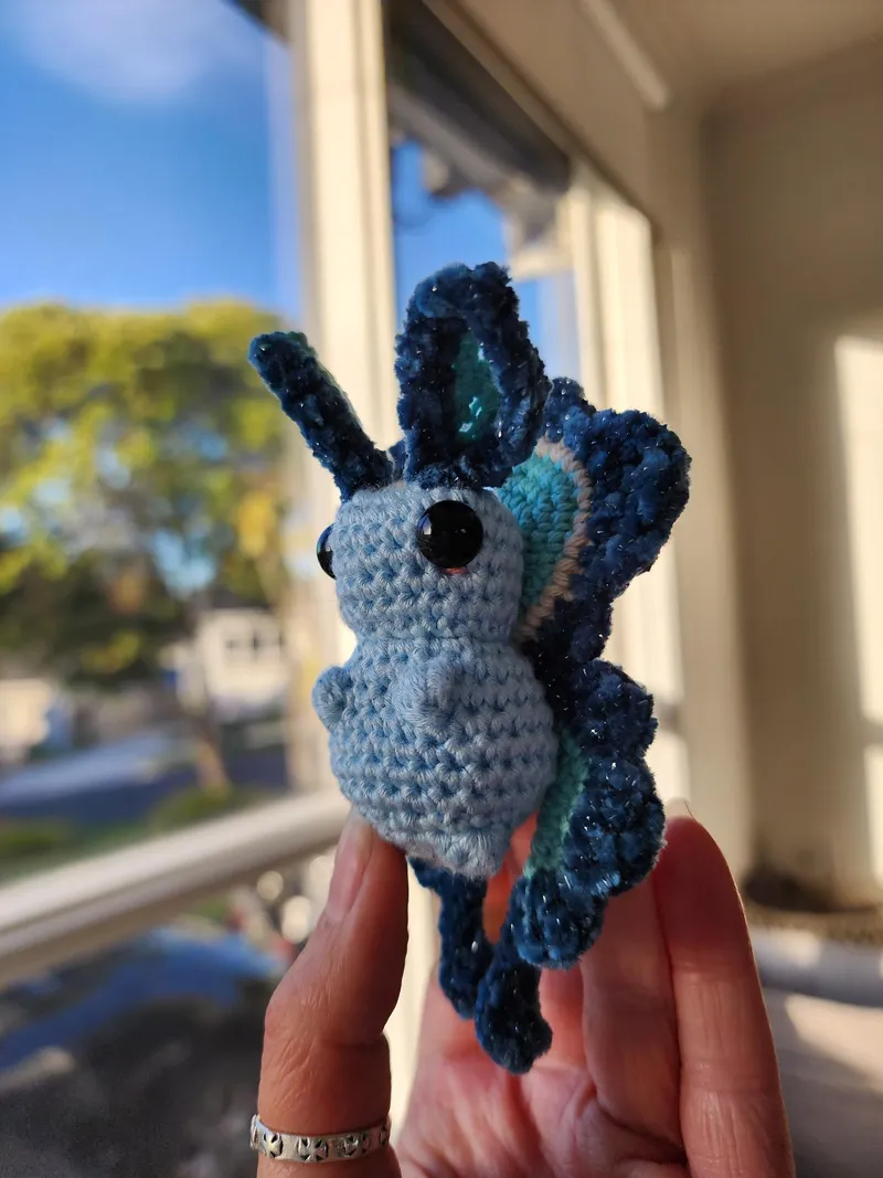 A sparkly blue crochet butterfly.