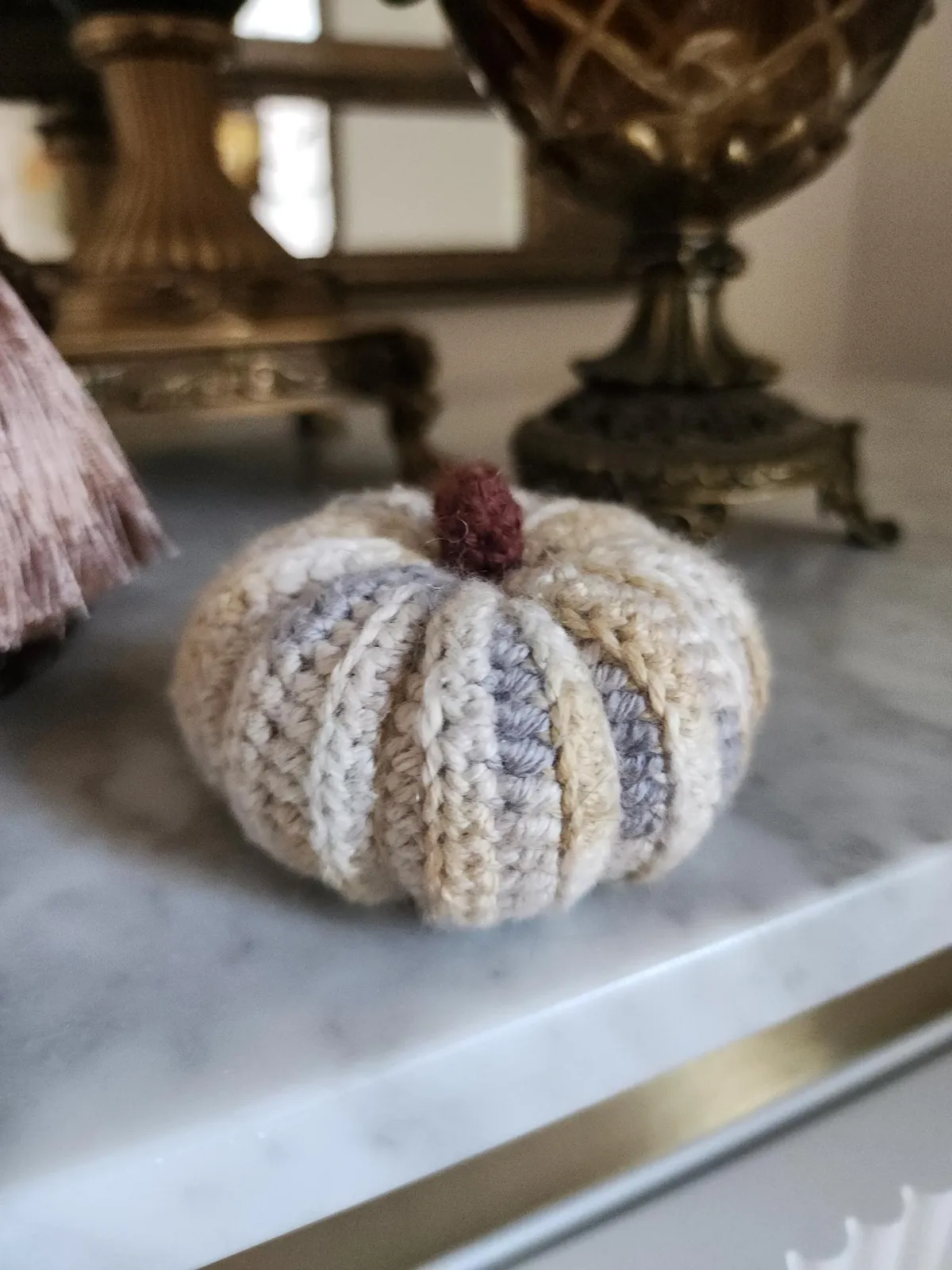 Crochet pumpkin cat toy.