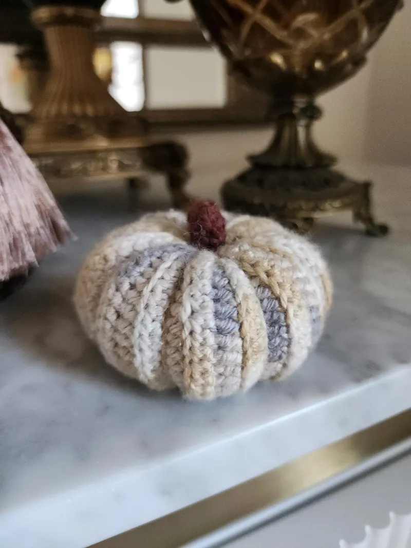 Crochet pumpkin cat toy.