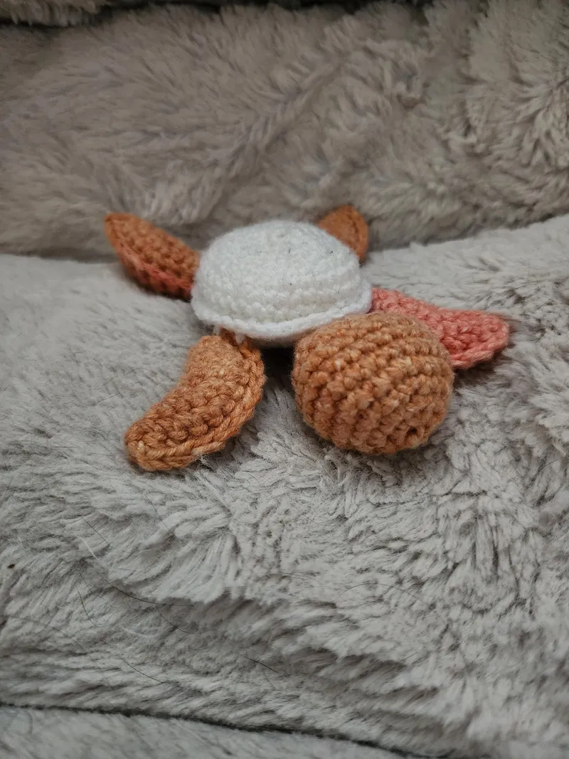 Orange crochet turtle.